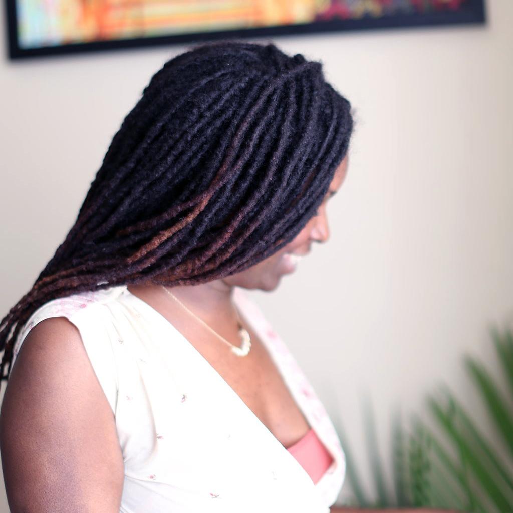 How to Retwist Your Locs At Home, According to Natural Hair Experts