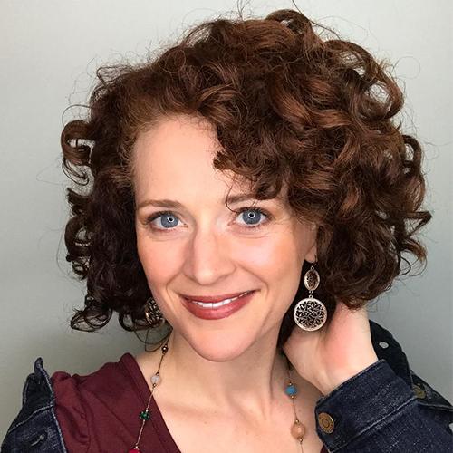 woman with short curly red hair