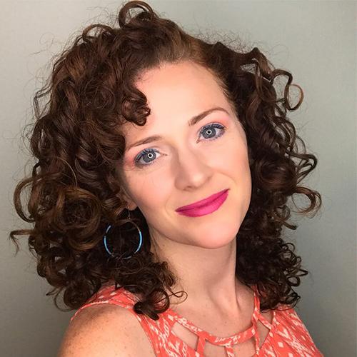 woman with short curly red hair