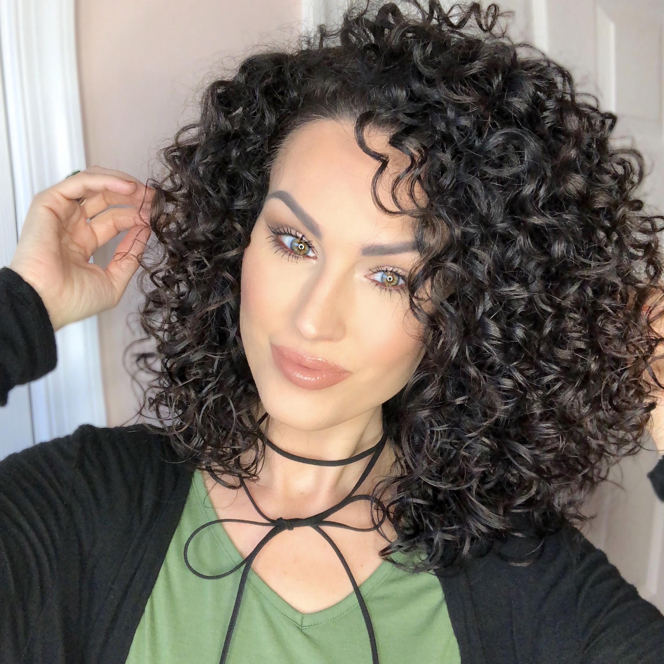 Woman with dark curly hair