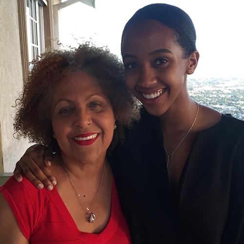 Two women hugging and smiling