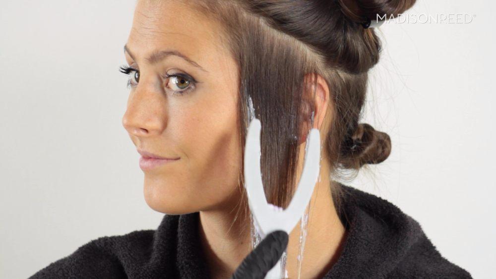 woman coloring hair using lightworks wishbone applicator